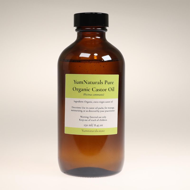 YumNaturals Pure Organic Castor Oil in dark brown glass bottle